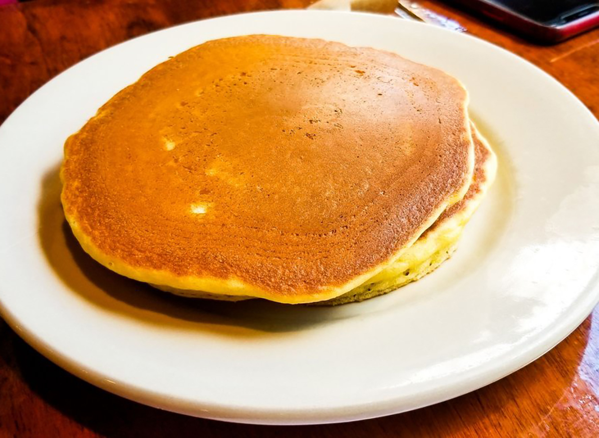 stack of two pancakes on a white plate