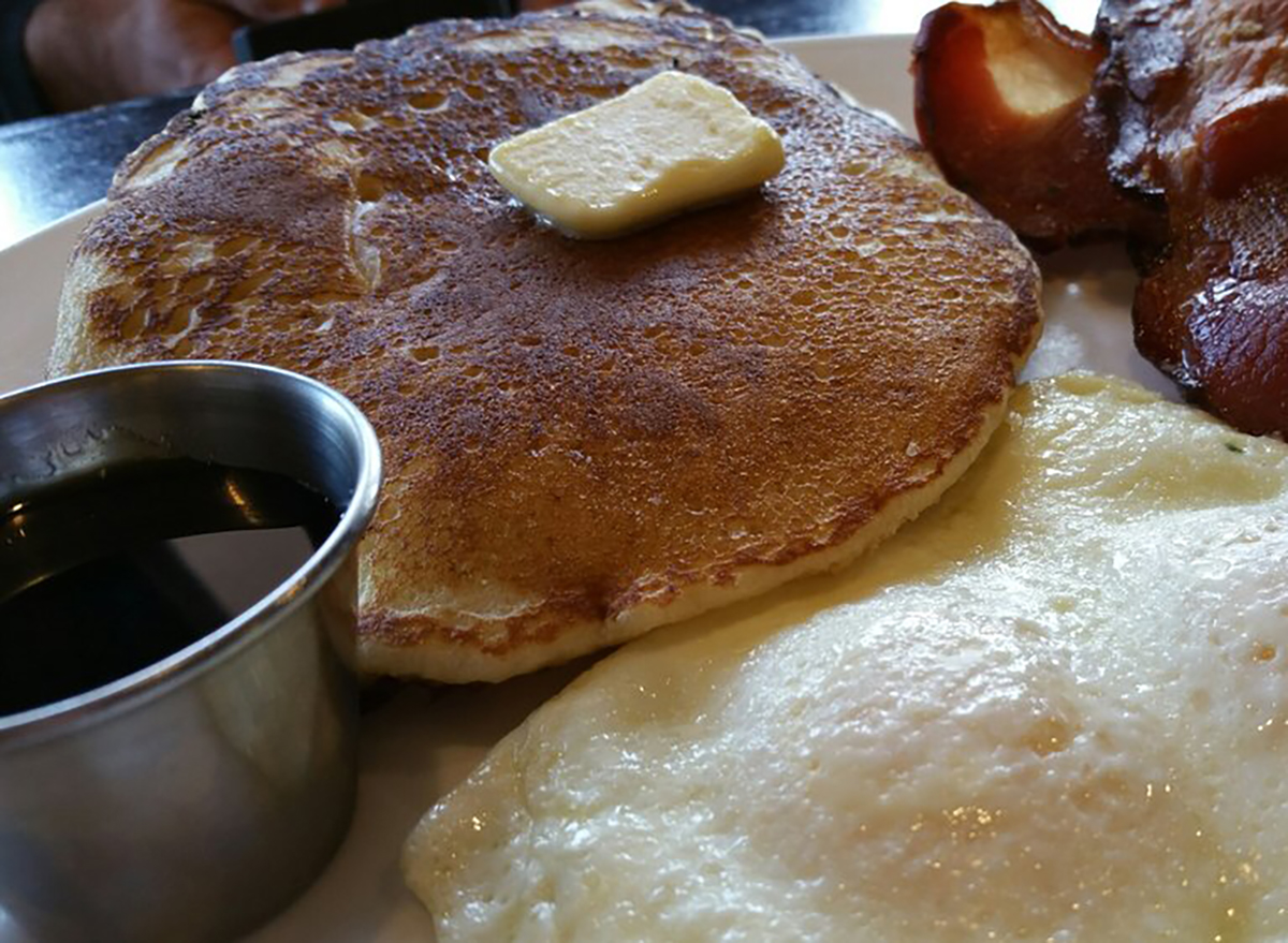 pancake with butter pat and fried egg