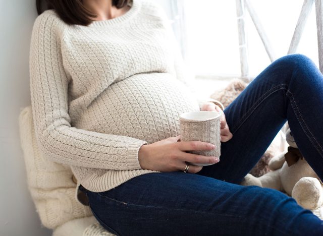pregnant woman drinking coffee