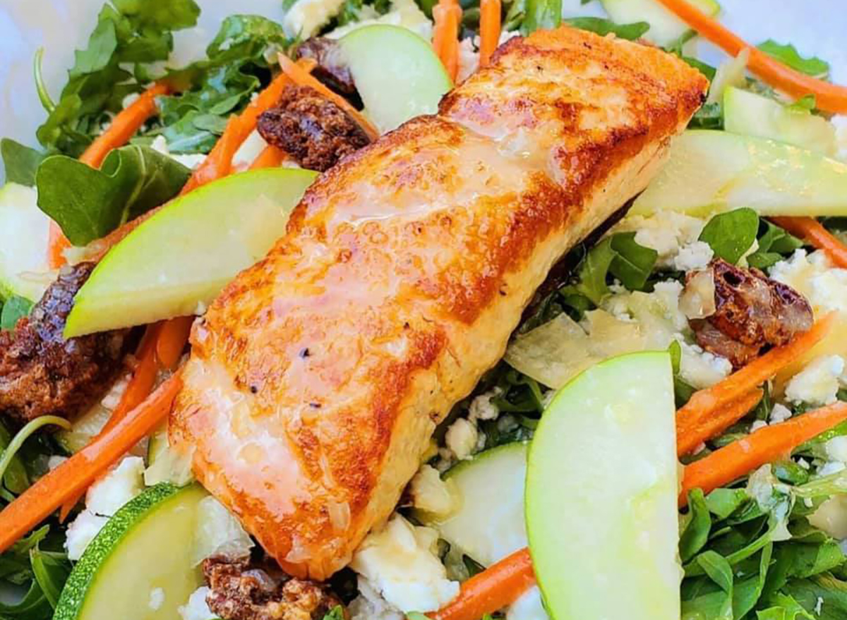 salad topped with salmon filet