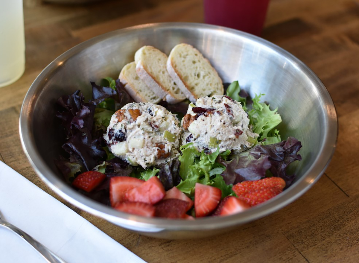 salad in bowl with strawberries and chicken salad