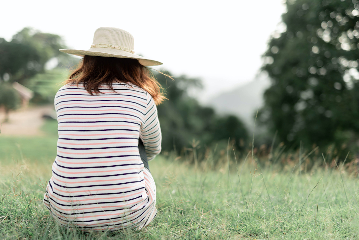 woman sad on the mountain