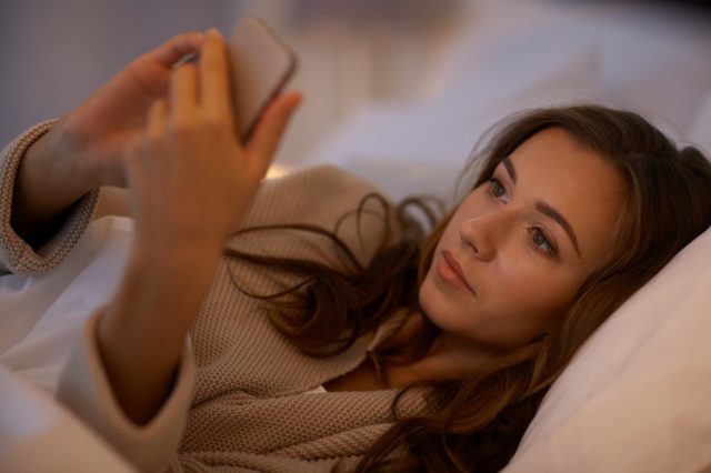 Woman texting on smartphone