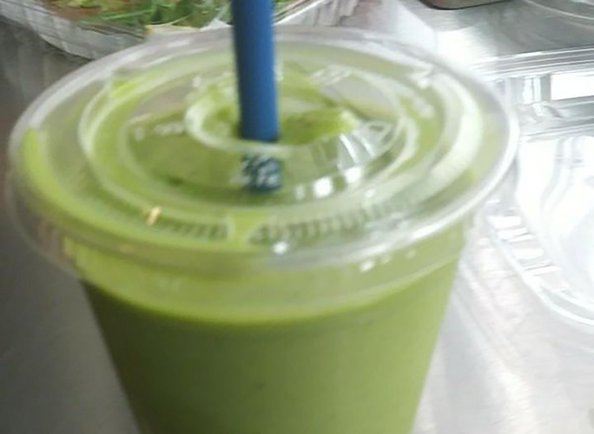 green smoothie with blue straw