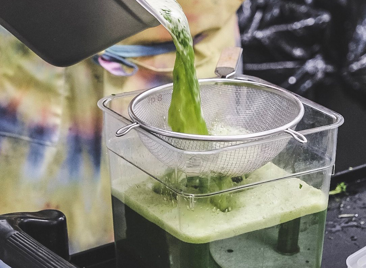 green juice being strained