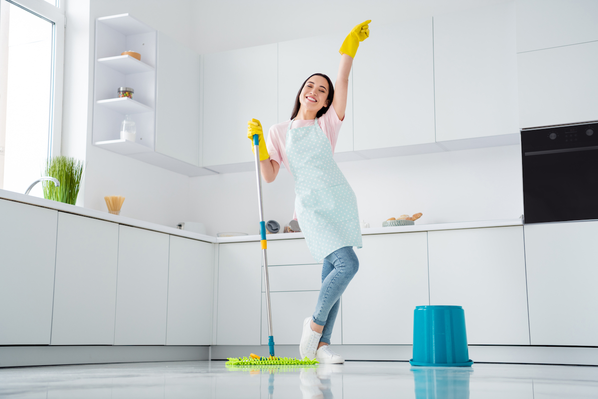 happy person cleaning her home