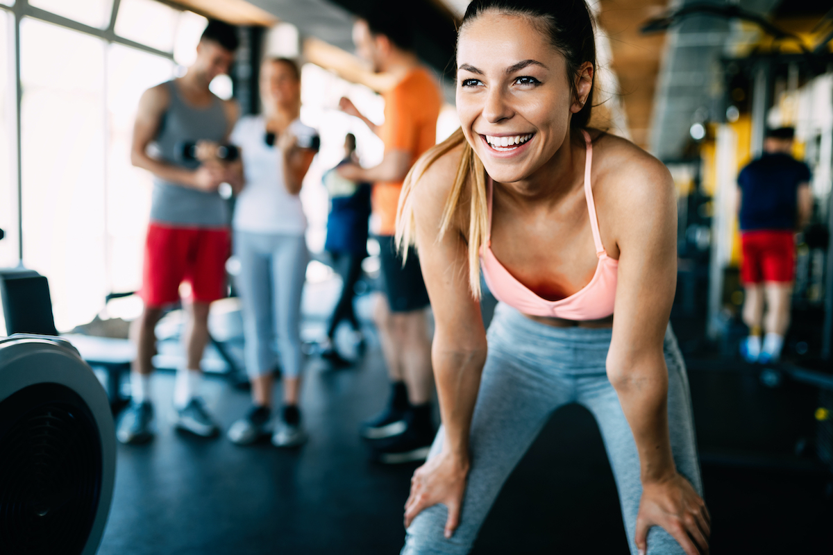 Close up image of attractive fit woman in gym