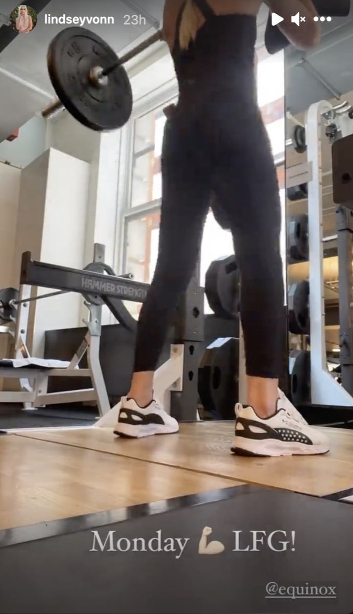 lindsey vonn in black outfit doing squats