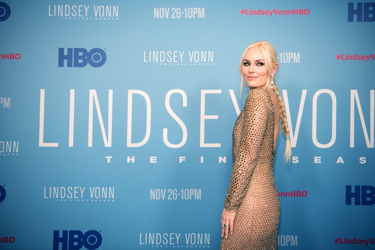 lindsey vonn on red carpet in gold dress