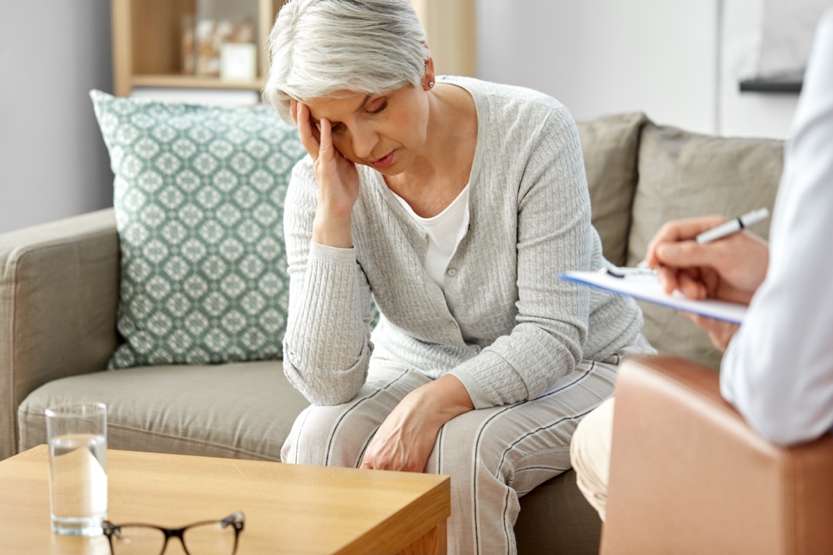 Unhappy senior woman patient and psychologist