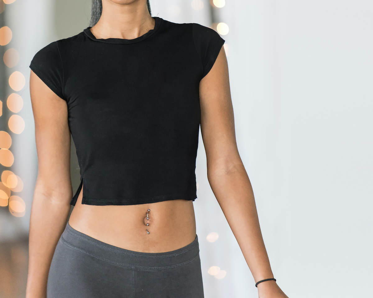 Young woman in black midriff tee shirt