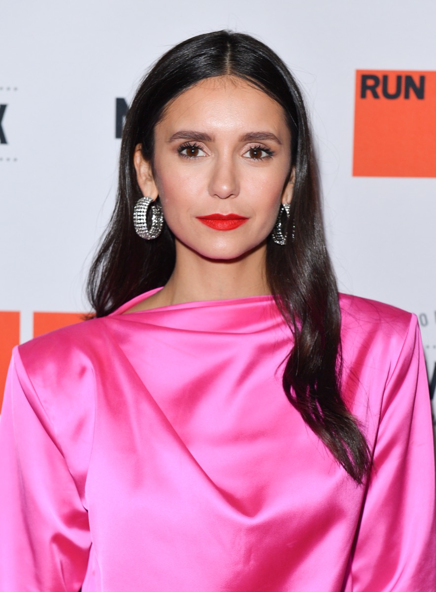 nina dobrev in pink dress on red carpet