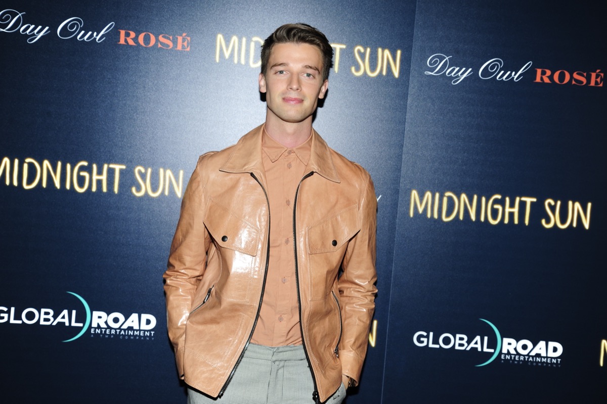 patrick schwarzenegger in tan leather jacket on red carpet