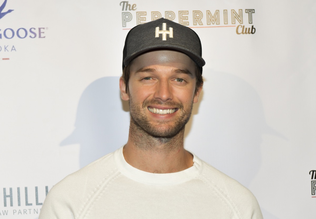 patrick schwarzenegger smiling on red carpet