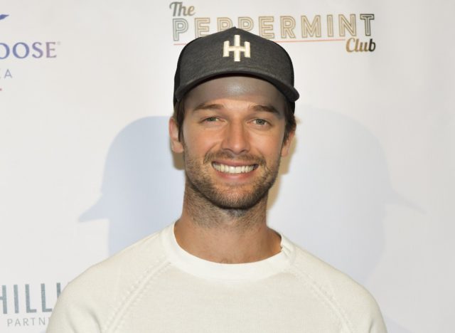 patrick schwarzenegger smiling on red carpet