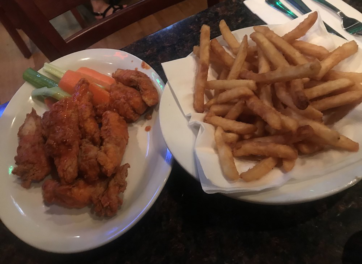 plate of chicken tenders and plate of fries