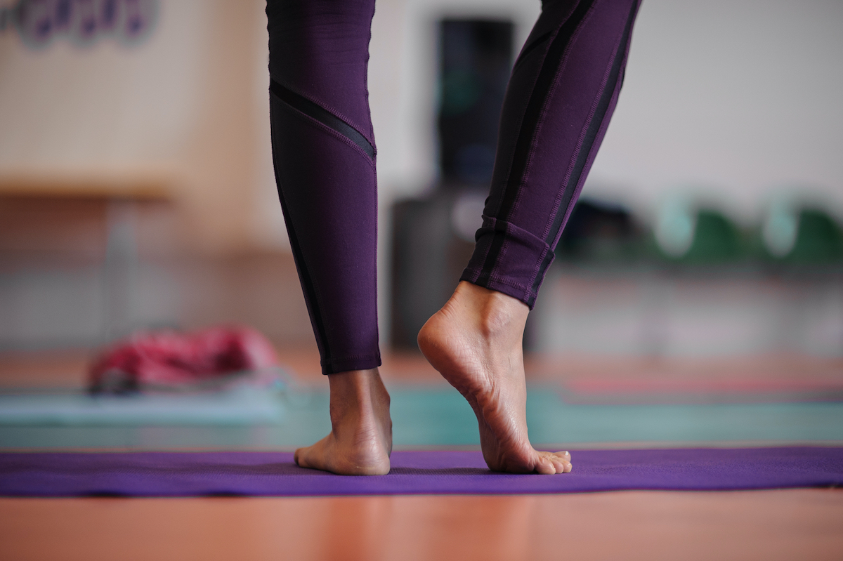 woman standing at yoga class