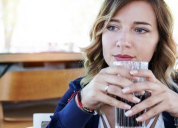 Woman drinking soda outdoors