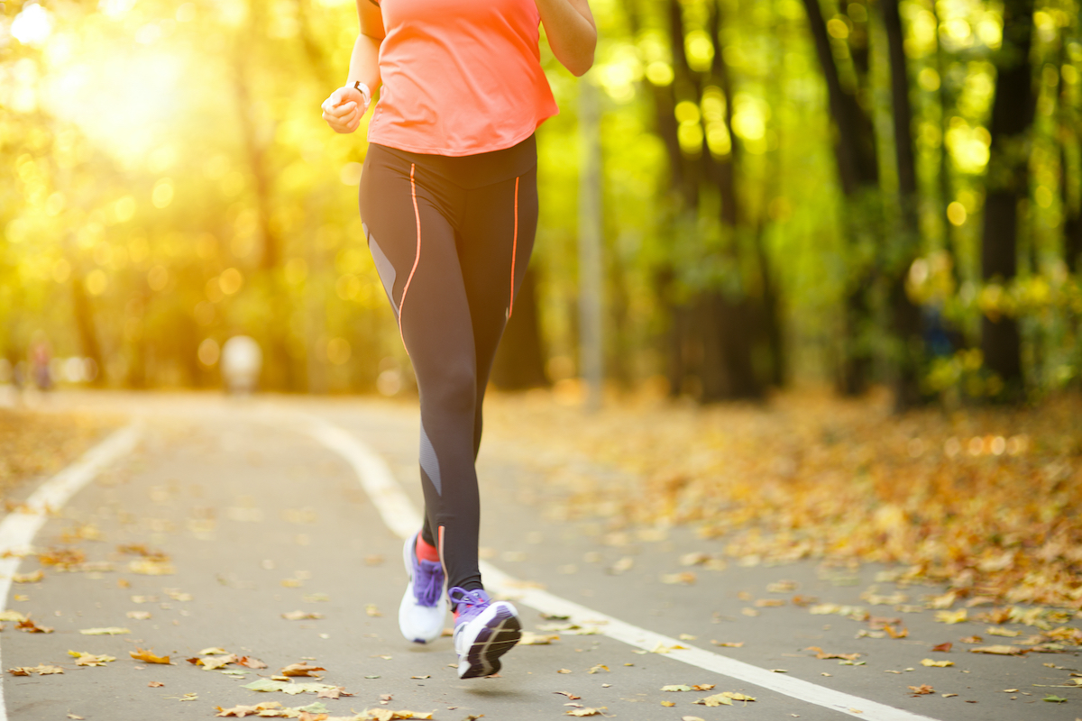 Woman exercise walking outdoors, shoes closeup