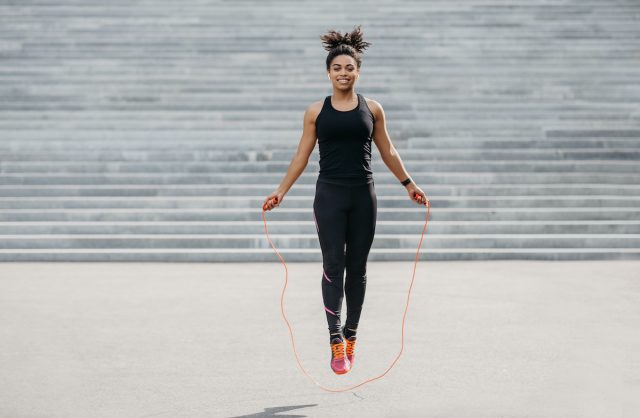 woman jumping rope outside