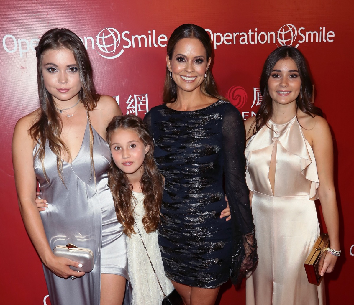brooke burke and three daughters on red carpet