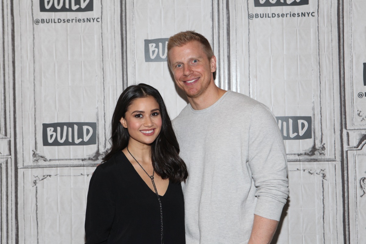 catherine giudici and sean lowe posing on red carpet