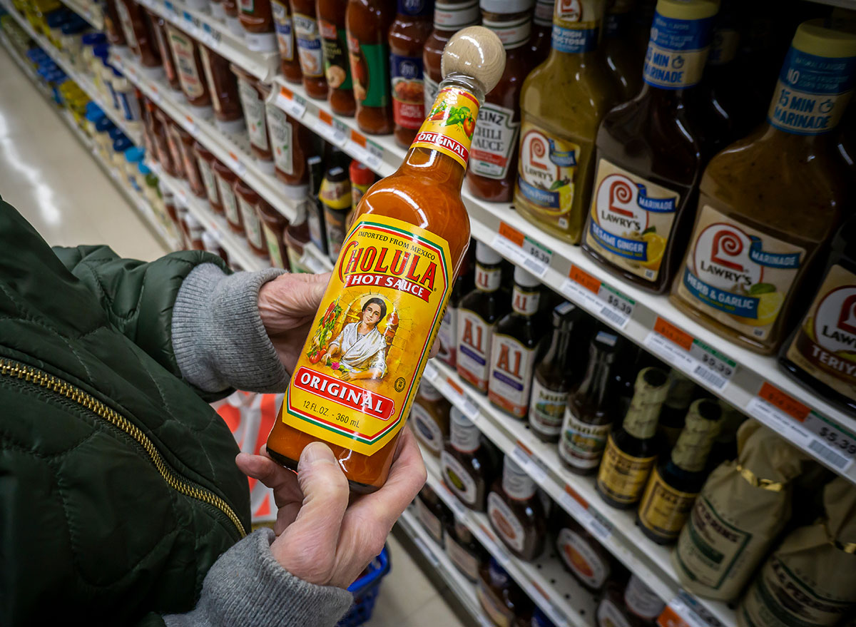 cholulua hot sauce holding