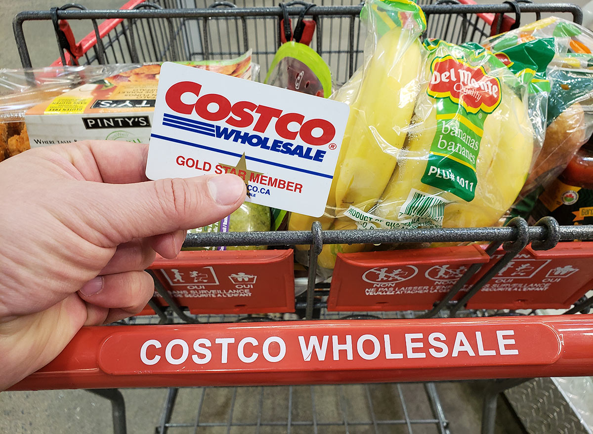 costco card and cart with groceries