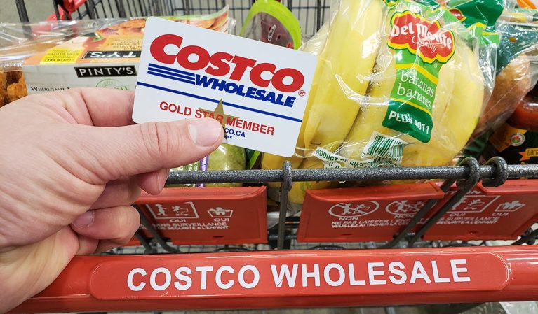 costco card and cart with groceries