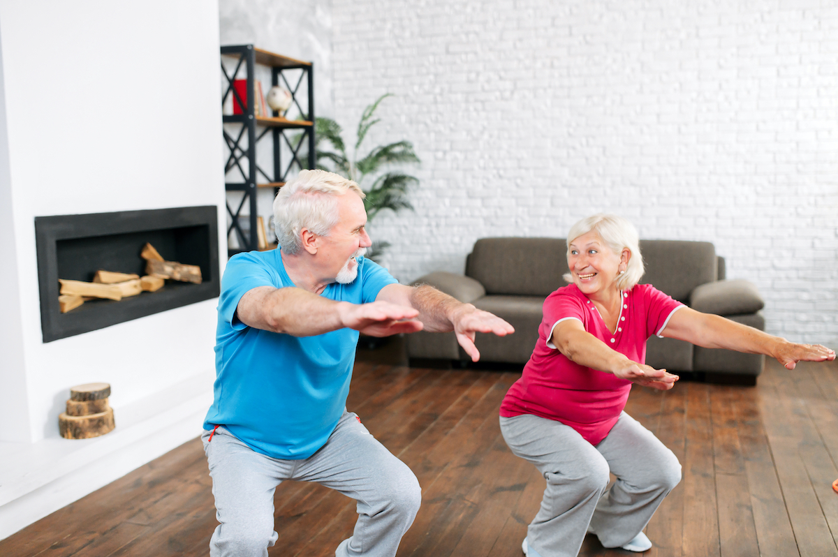 elderly couple squats