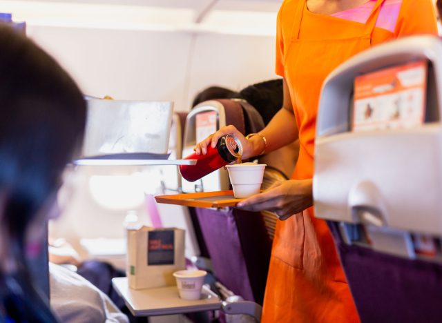 This Is the "Most Annoying" Coca-Cola Drink to Order on a Plane, Flight Attendant Says