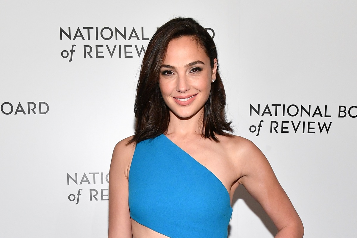 gal gadot smiling in blue one-shoulder dress