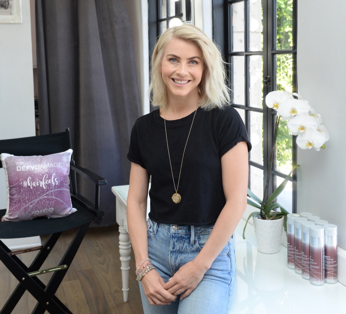 julianne hough smiling in black shirt and jeans