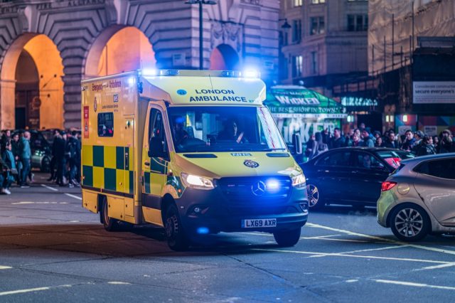 Ambulance at Piccadilly Circus at night