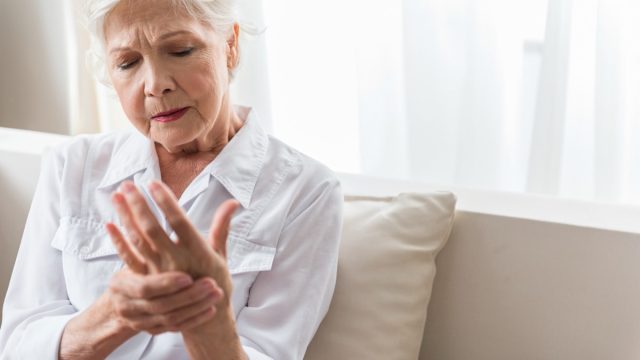older woman with hand pain