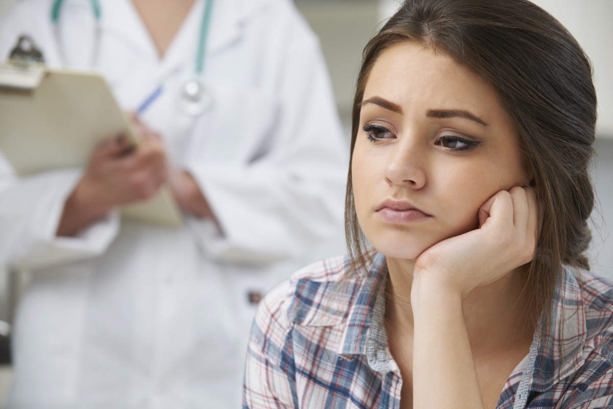 Teenage Girl With Appointment At Doctor's Surgery