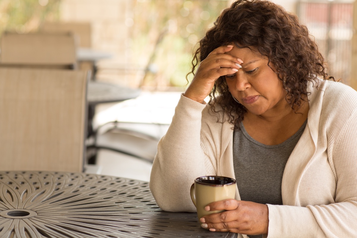 woman drinking coffee and thinking