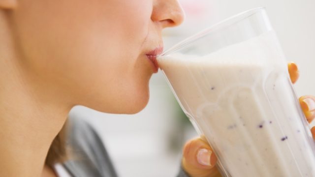 woman drinking cocktail