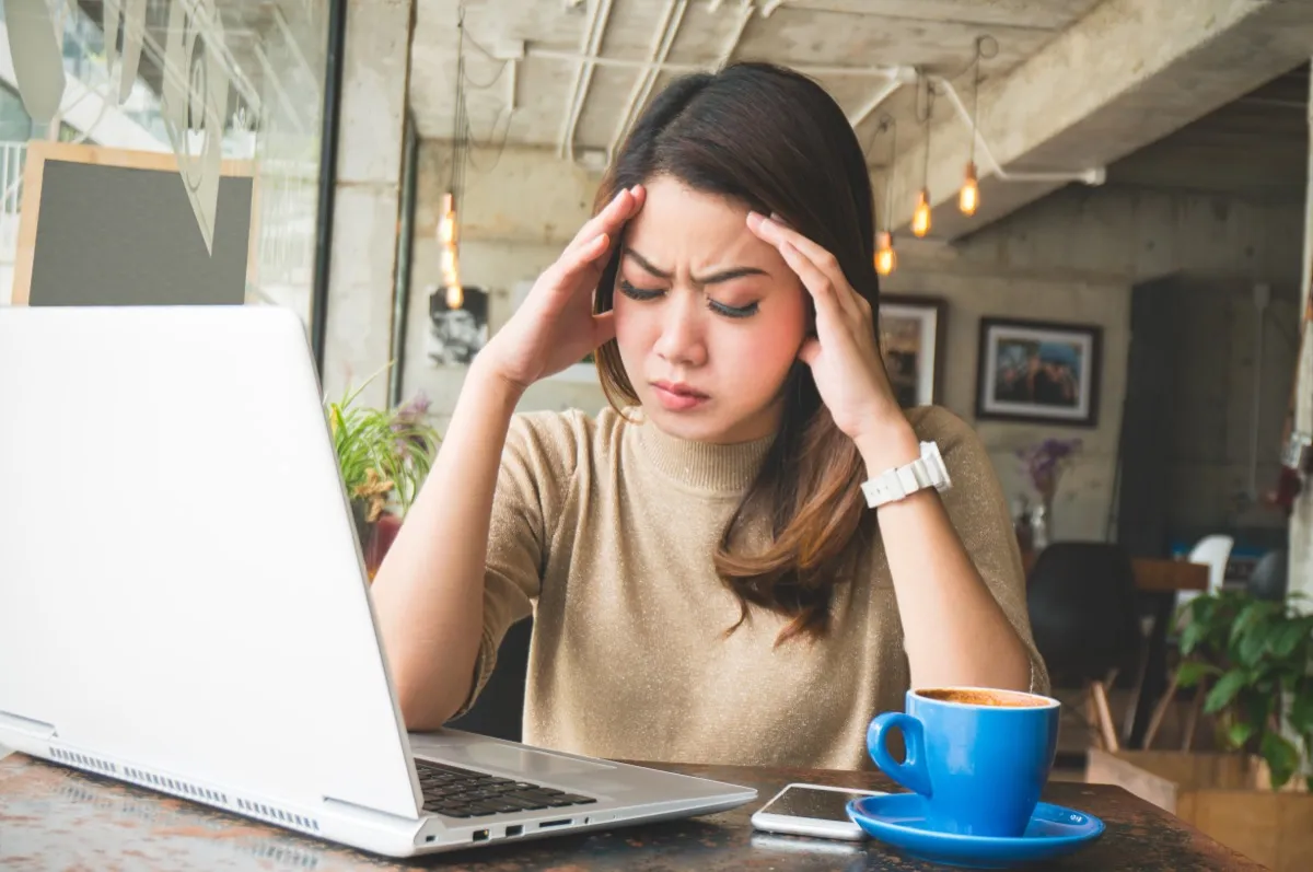 woman stressed at her desk