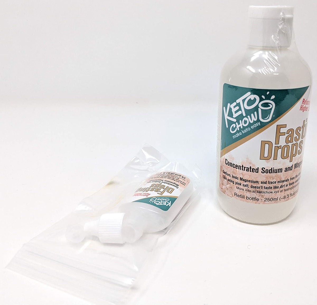 bottle of keto chow fasting drops on white background