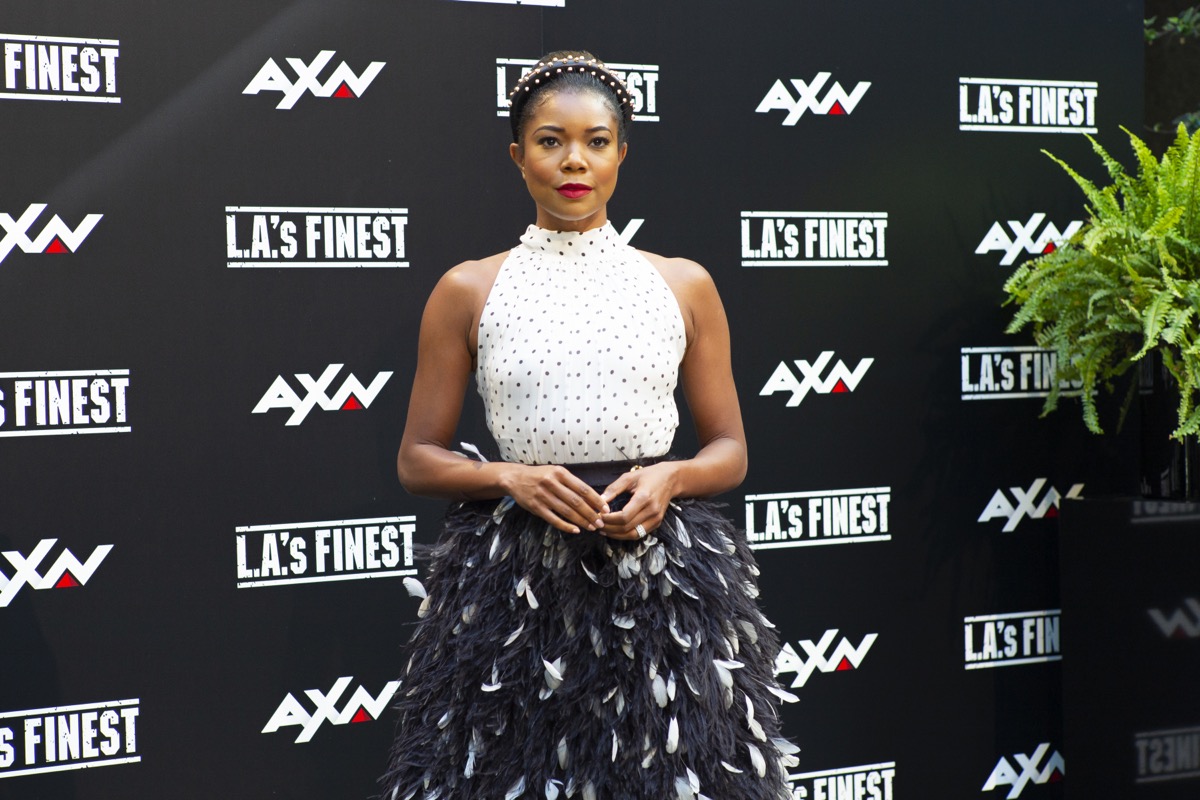 gabrielle union in white sleevelss top and black skirt