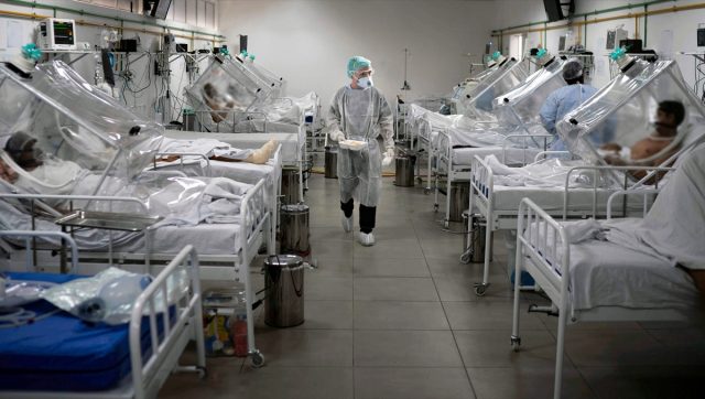 Medical staff work in the Intensive Care Unit (ICU) for several patients with COVID-19 in the hospital.