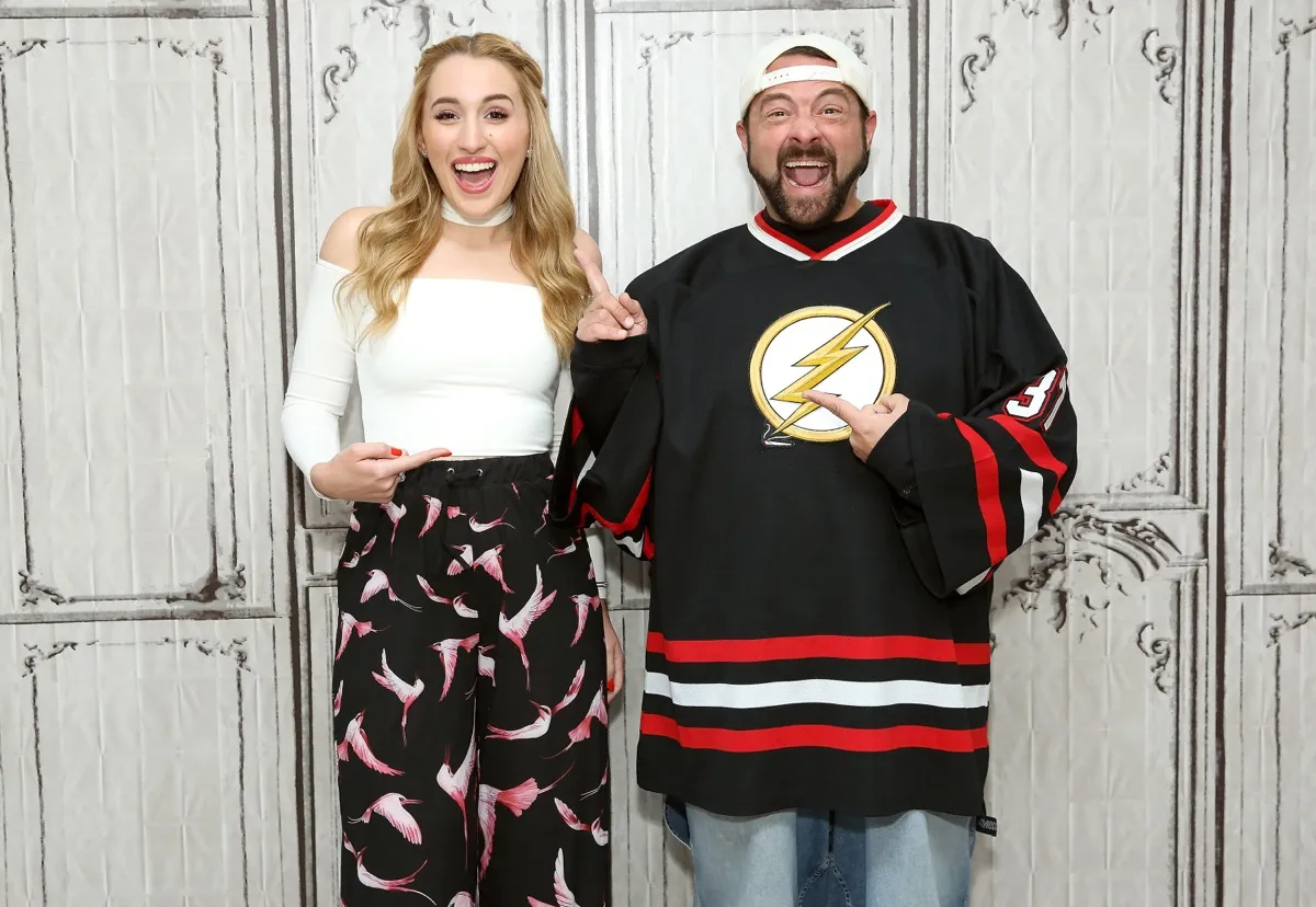kevin smith and harley quinn smith posing on red carpet