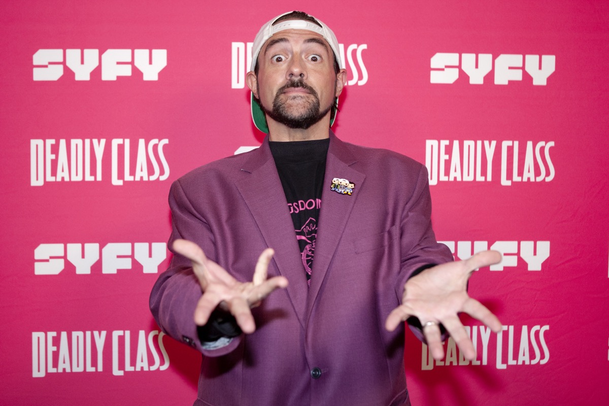 kevin smith in purple jacket making surprised face on red carpet