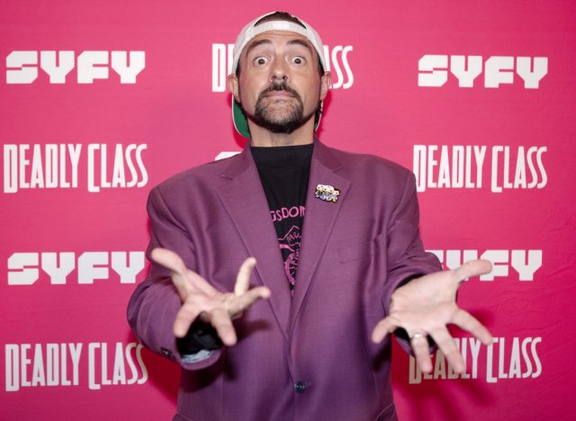 kevin smith in purple jacket making surprised face on red carpet