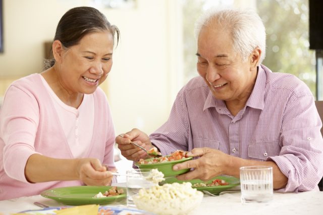 older couple sharing a meal at home