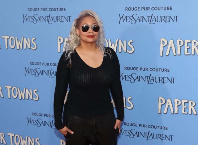 raven symone in black shirt on red carpet