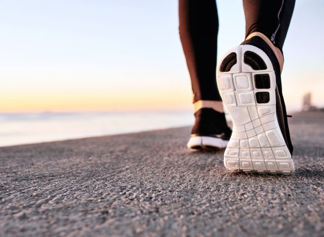 athlete-walking-on-pavement-shoe-closeup