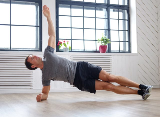 man-doing-side-planks-at-home