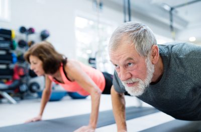 older-man-and-woman-doing-plank-exercises